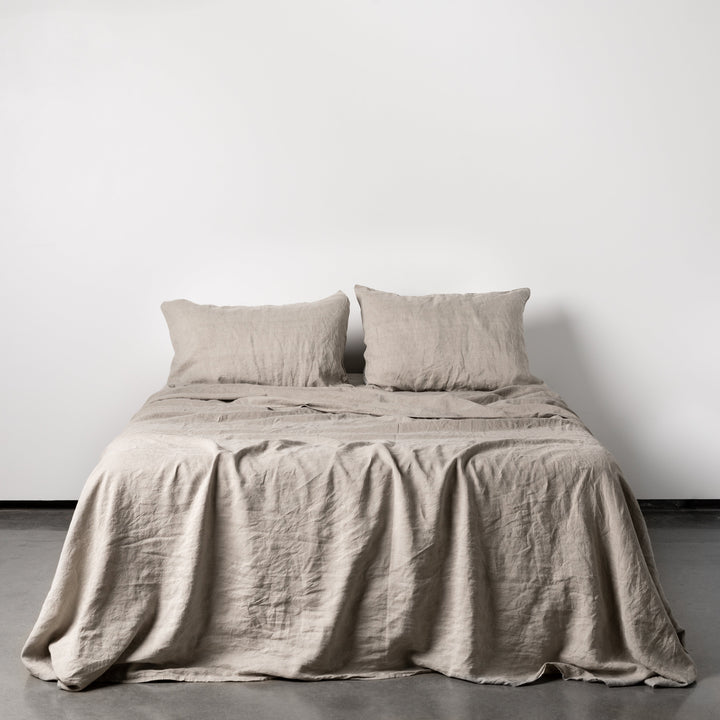 Foxtrot Home French Flax Linen styled in a bedroom with Natural Fitted Sheet.