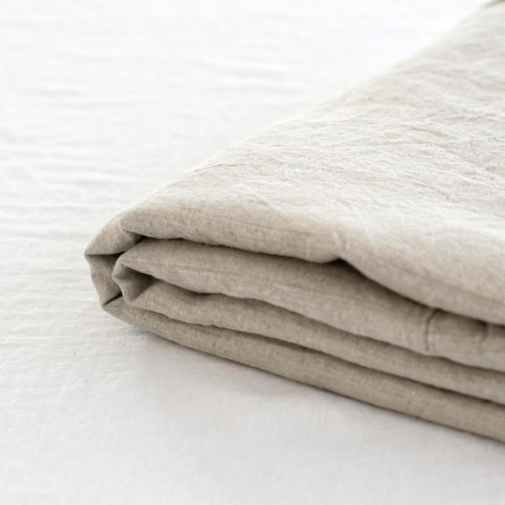 Foxtrot Home French Flax Linen styled in a bedroom with Natural Flat Sheet.