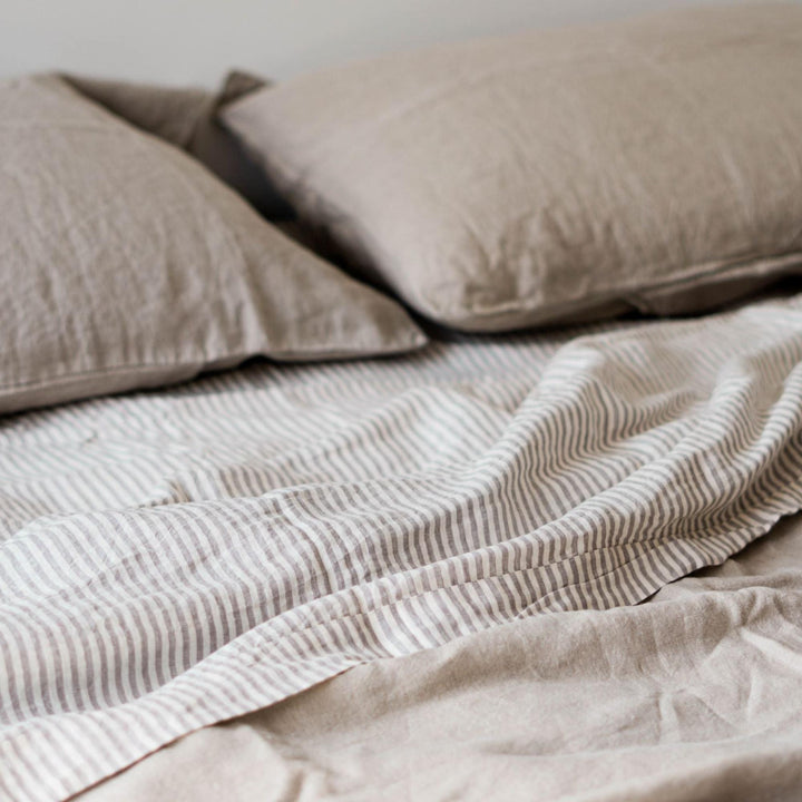 Foxtrot Home French Flax Linen styled in a bedroom with Natural Sheets Sets.