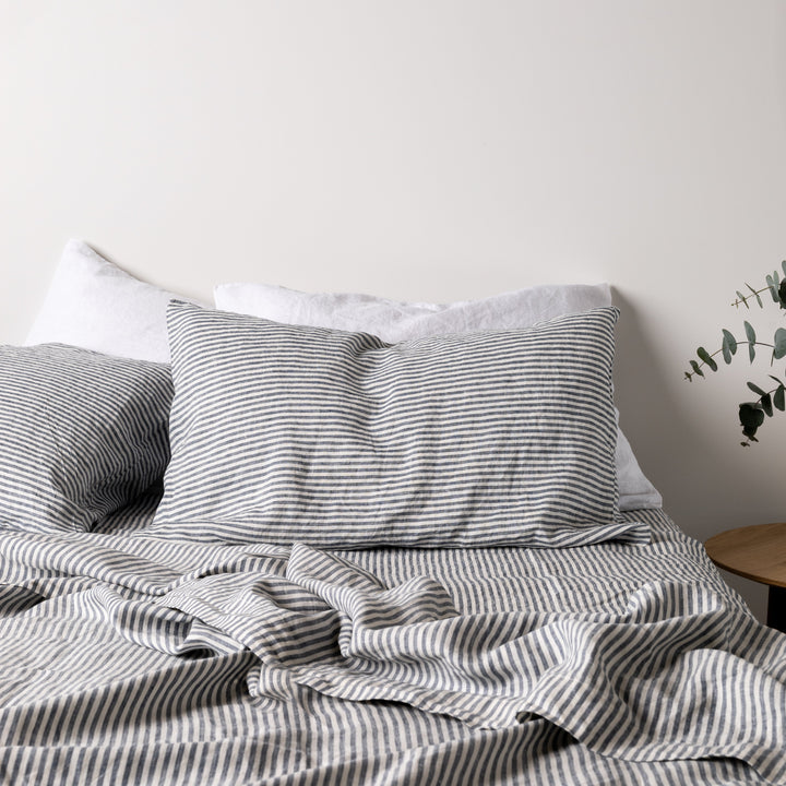 Foxtrot Home French Flax Linen styled in a bedroom with Navy Stripes Fitted Sheet.