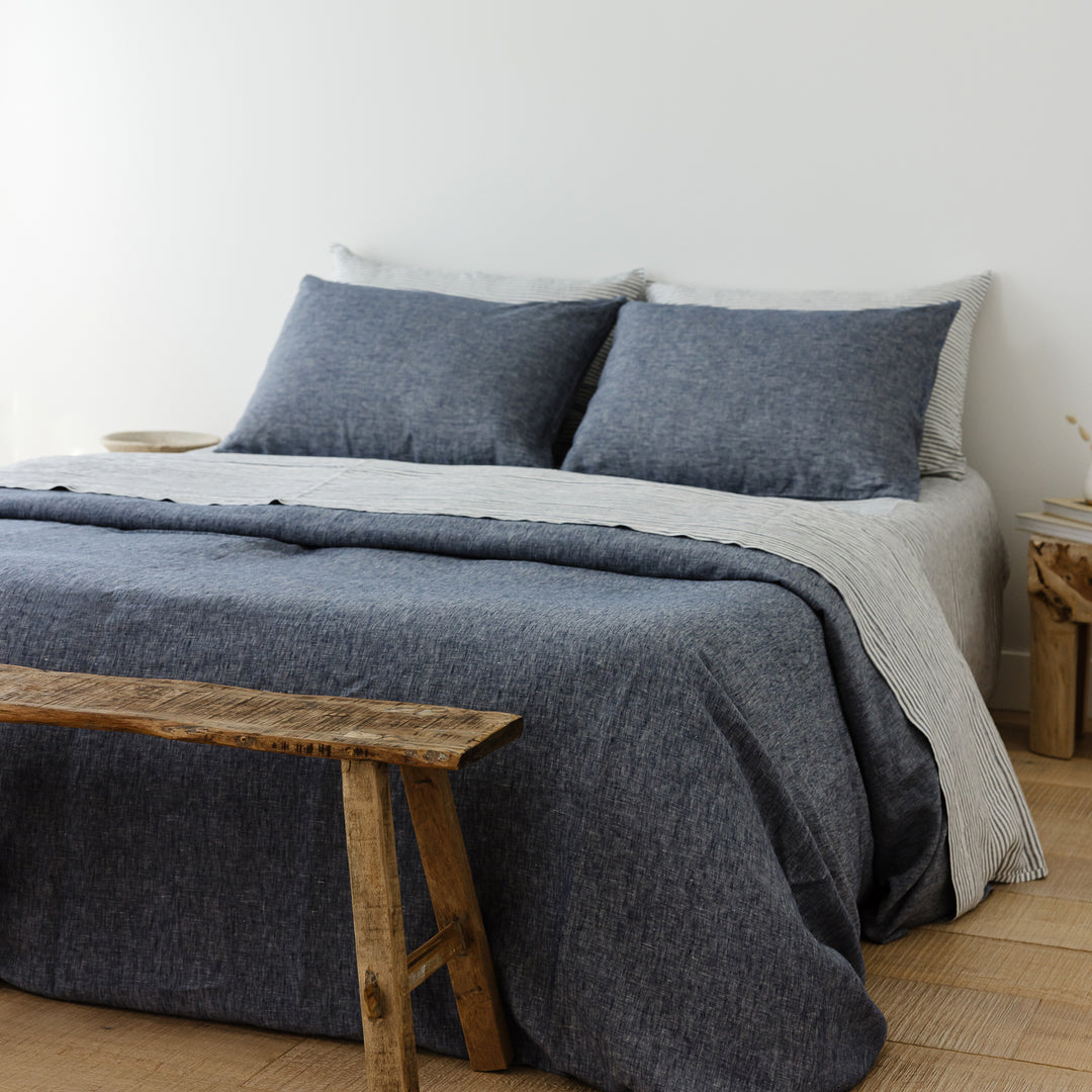 Foxtrot Home French Flax Linen styled in a bedroom with Navy Stripes Fitted Sheet.