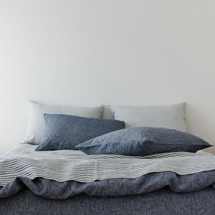 Foxtrot Home French Flax Linen styled in a bedroom with Navy Stripes Sheets Set.