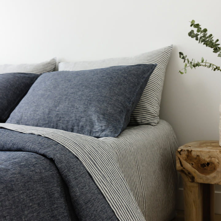 Foxtrot Home French Flax Linen styled in a bedroom with Navy Stripes Sheets Set.
