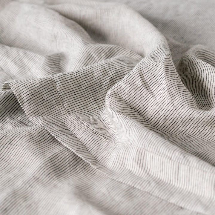 Foxtrot Home French Flax Linen styled in a baby's bedroom with a Pinstripe Cot Duvet.