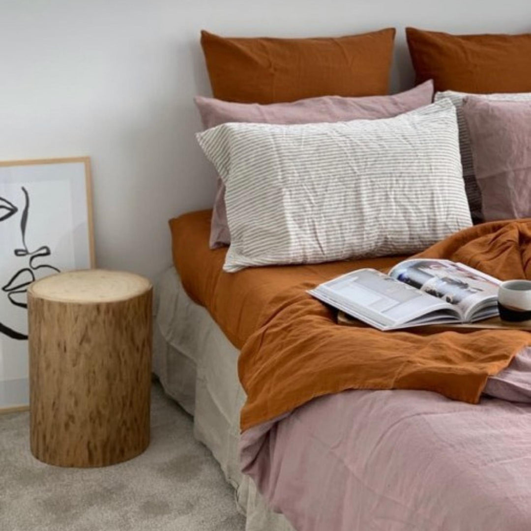Foxtrot Home French Flax Linen styled in a bedroom with Rosewood Duvet, Grey Stripes and Pillowcases.