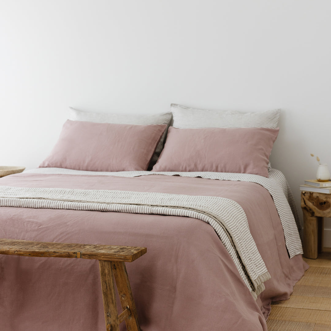 Foxtrot Home French Flax Linen styled in a bedroom with Rosewood Duvet, Grey Stripes and Pillowcases.