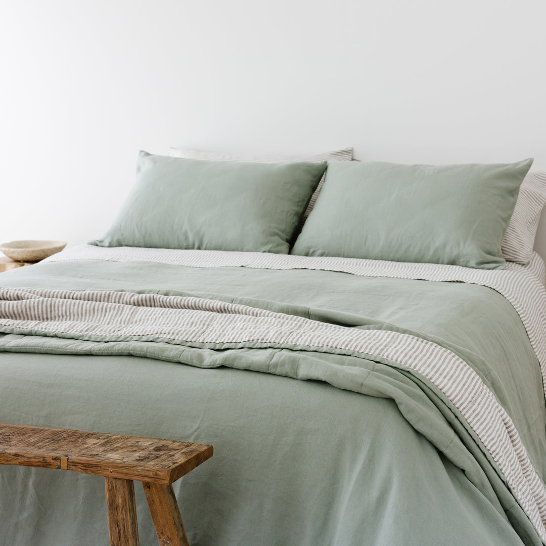 Foxtrot Home French Flax Linen styled in a bedroom with Sage Green & Grey Stripes Quilt.