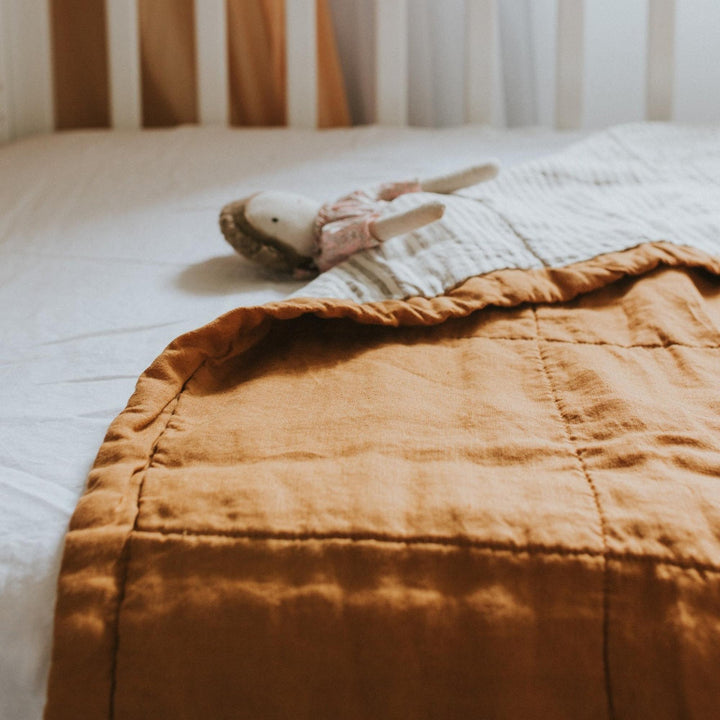 Foxtrot Home French Flax Linen styled in a bedroom with Tobacco and Pinstripes Quilt.