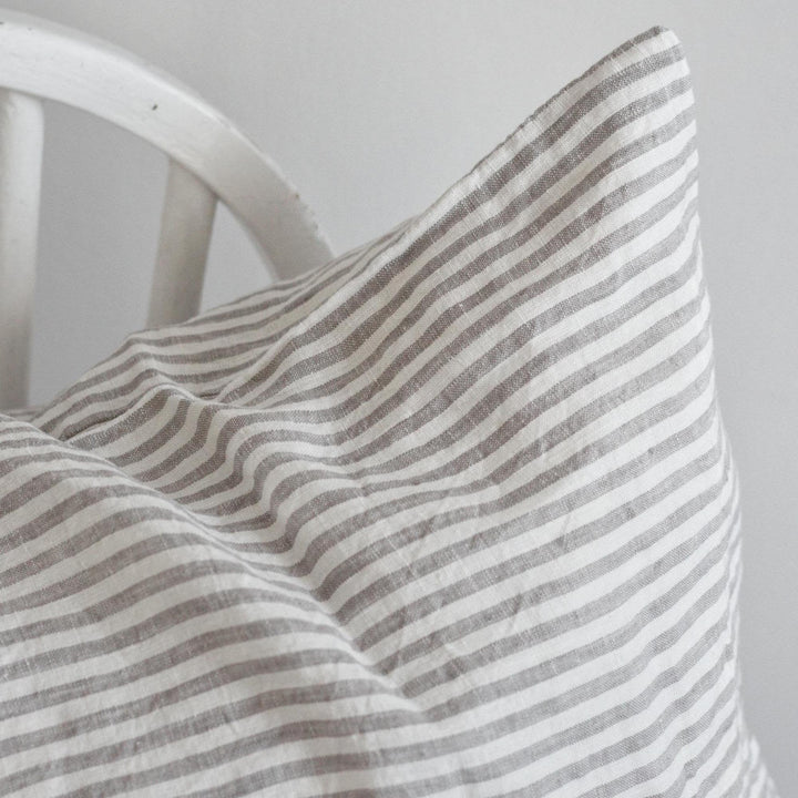 Foxtrot Home French Flax Linen styled in a bedroom with Grey Stripes Cushion Cover.