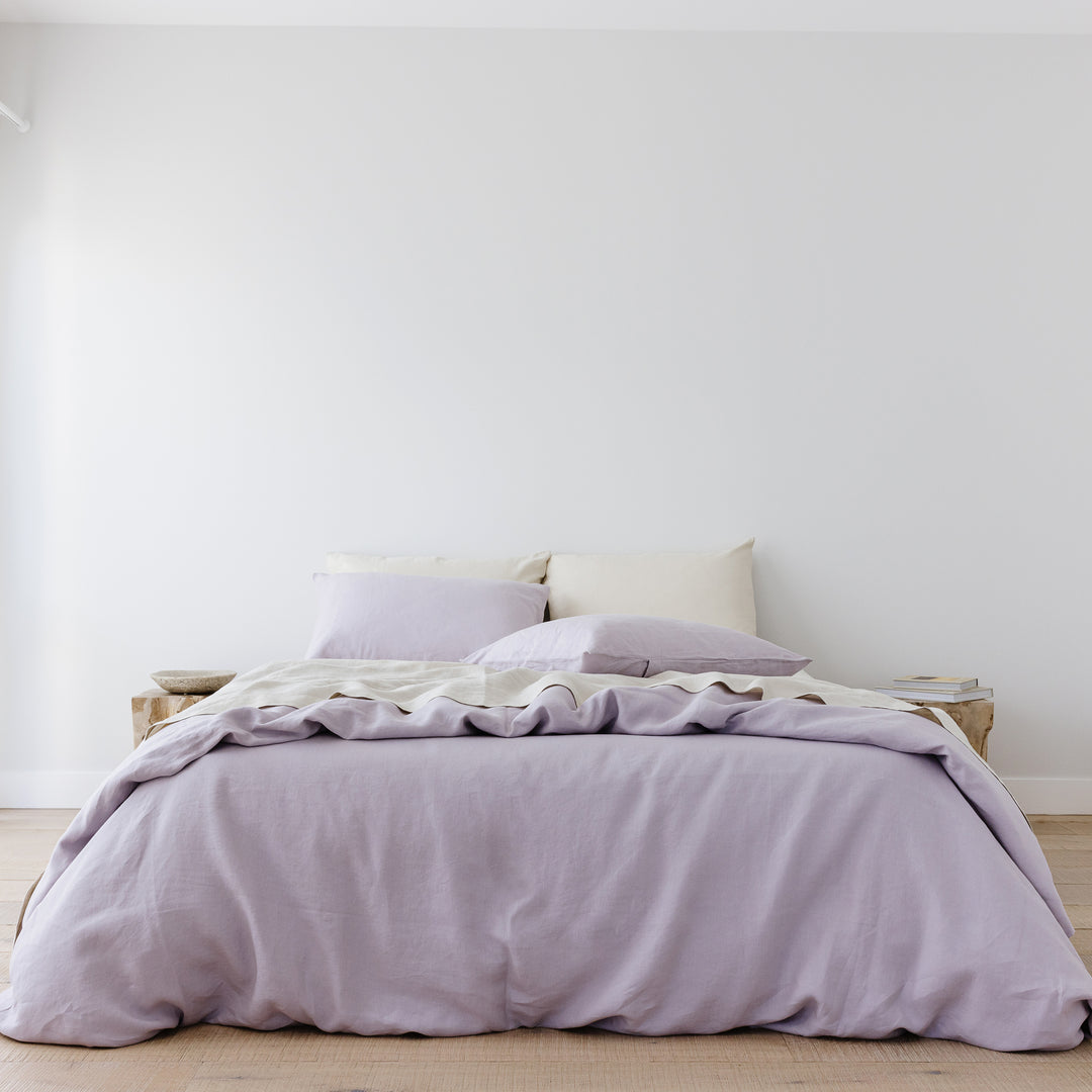 Foxtrot Home French Flax Linen styled in a bedroom with Lilac Purple Duvet.