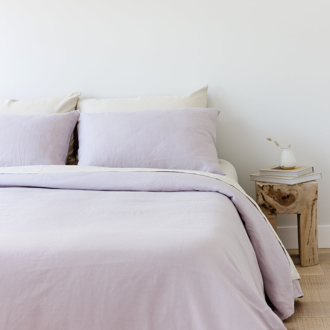 Foxtrot Home French Flax Linen styled in a bedroom with Lilac Purple Duvet.