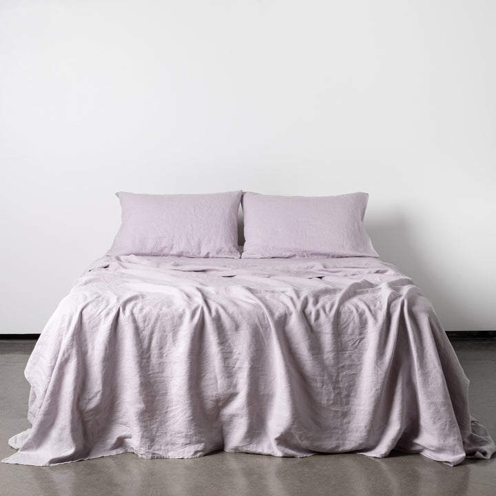 Foxtrot Home French Flax Linen styled in a bedroom with Lilac Purple Sheets Sets.