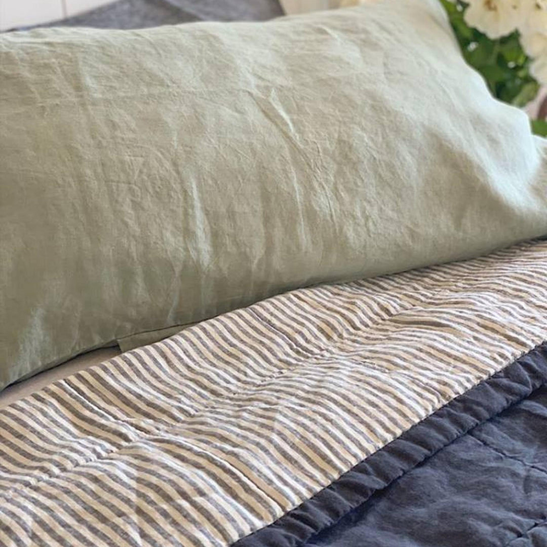 Foxtrot Home French Flax Linen styled in a bedroom with Navy & Blue Stripes Quilt.