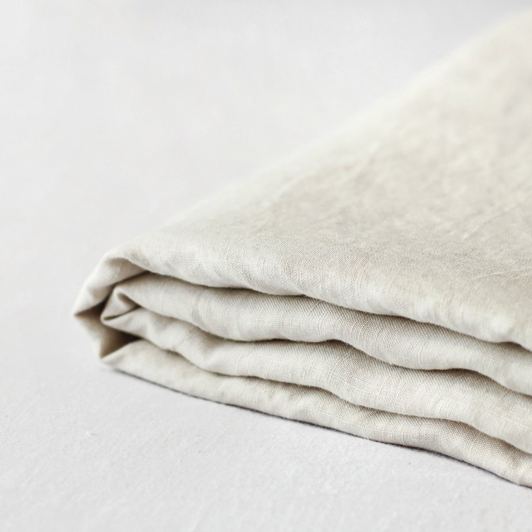 Foxtrot Home French Flax Linen styled in a bedroom with Oat Fitted Sheet.