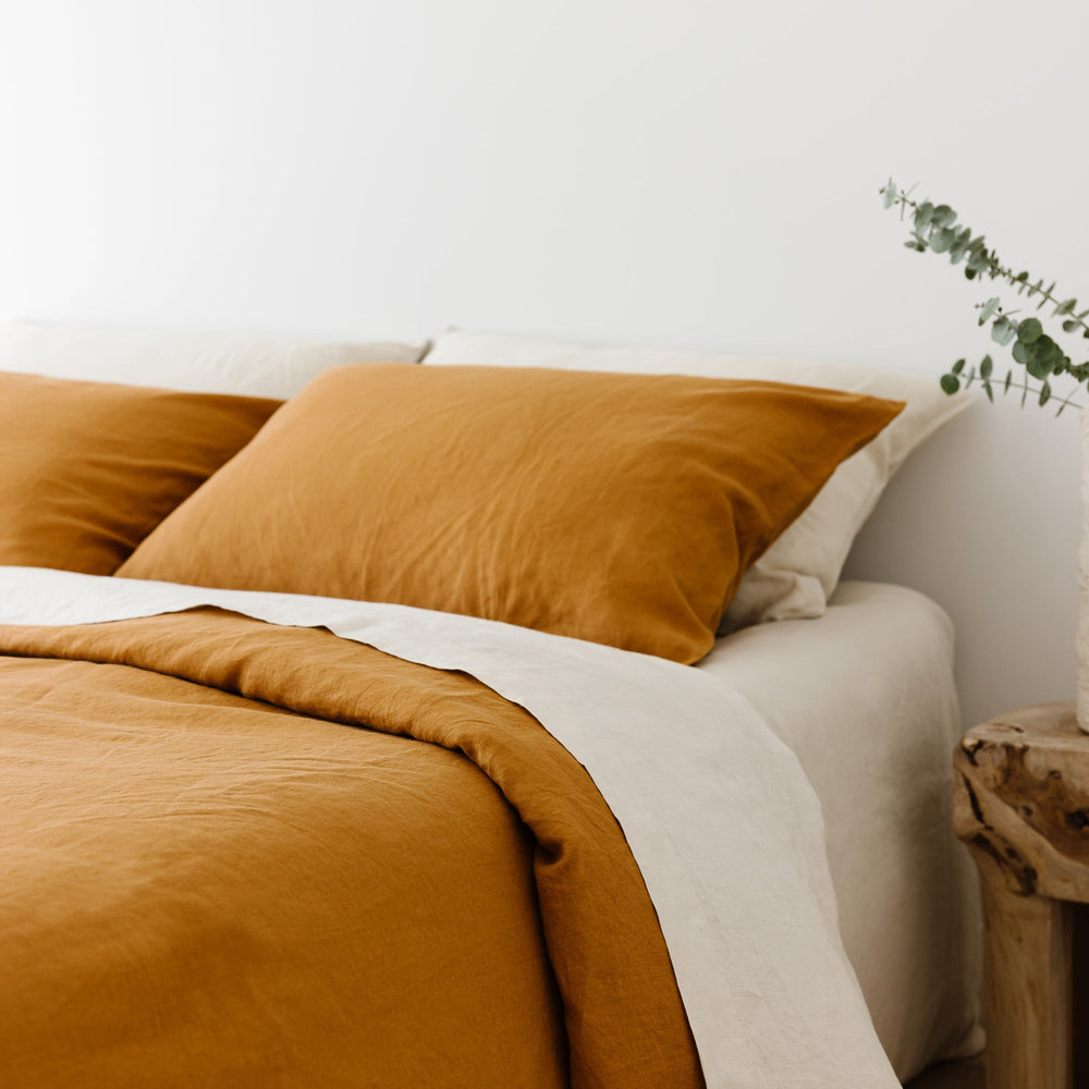 Foxtrot Home French Flax Linen styled in a bedroom with Oat Flat Sheet.