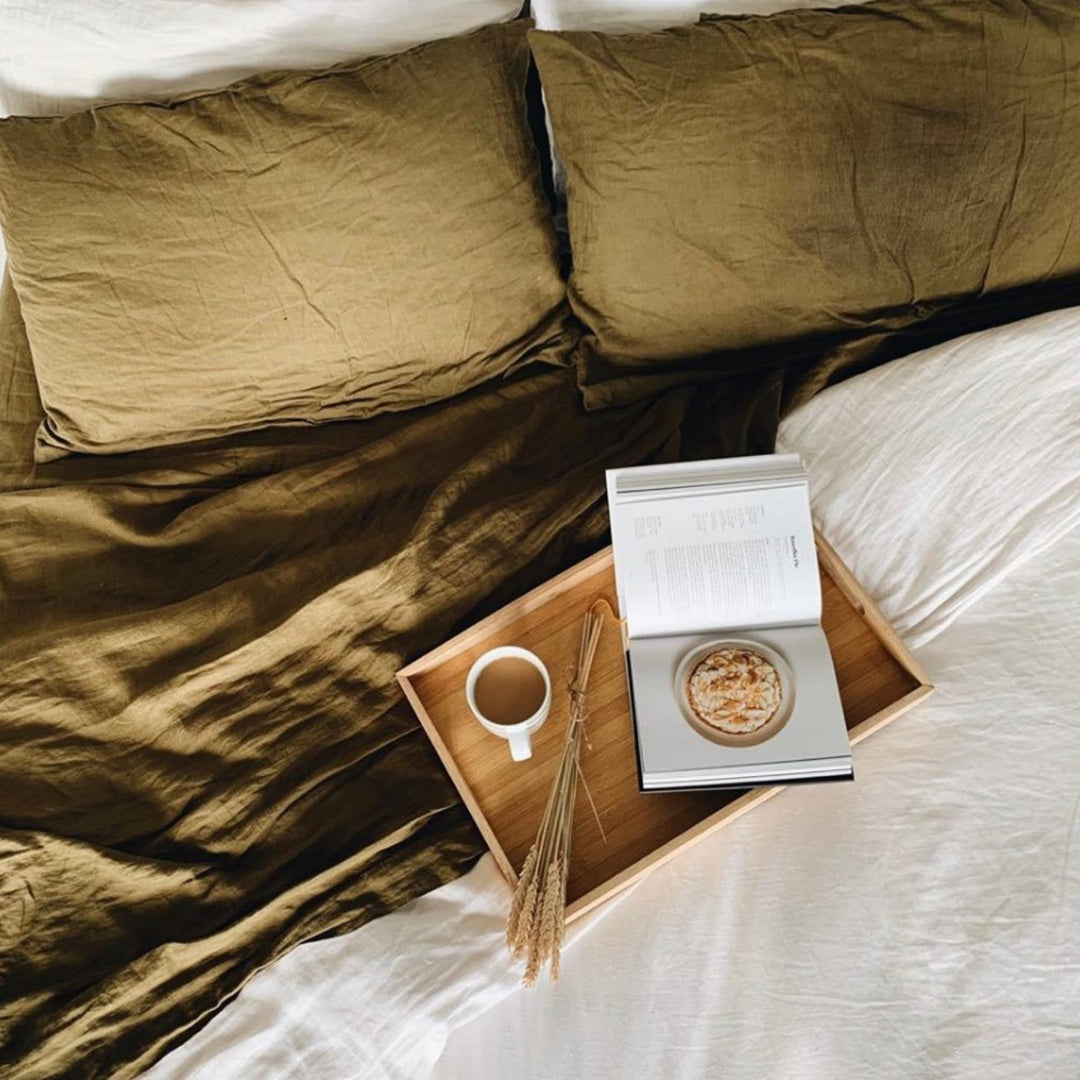 Foxtrot Home French Flax Linen styled in a bedroom with Olive Green Sheets Sets.