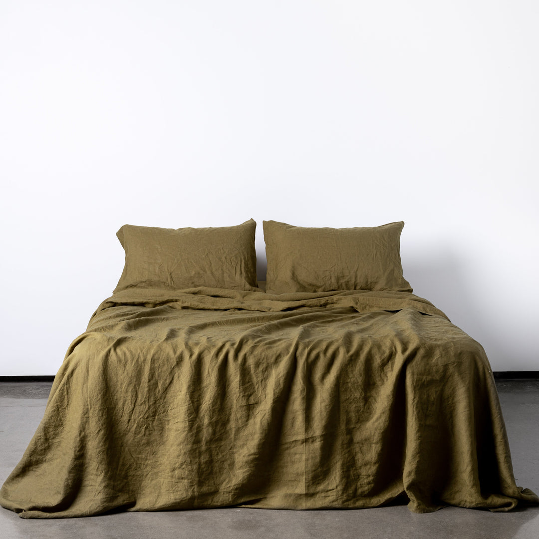 Foxtrot Home French Flax Linen styled in a bedroom with Olive Green Sheets Sets.