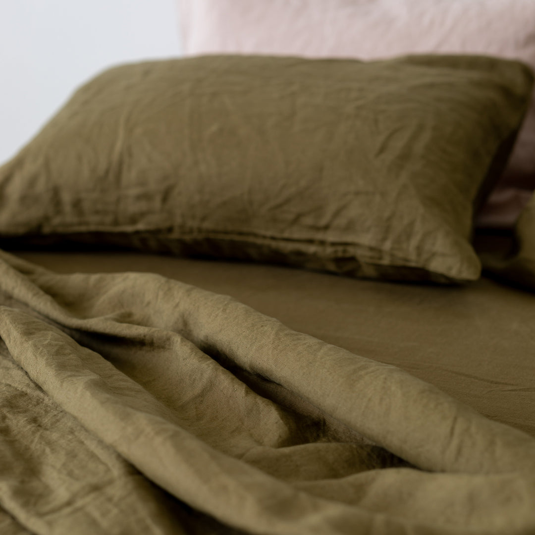 Foxtrot Home French Flax Linen styled in a bedroom with Olive Green Sheets Sets.