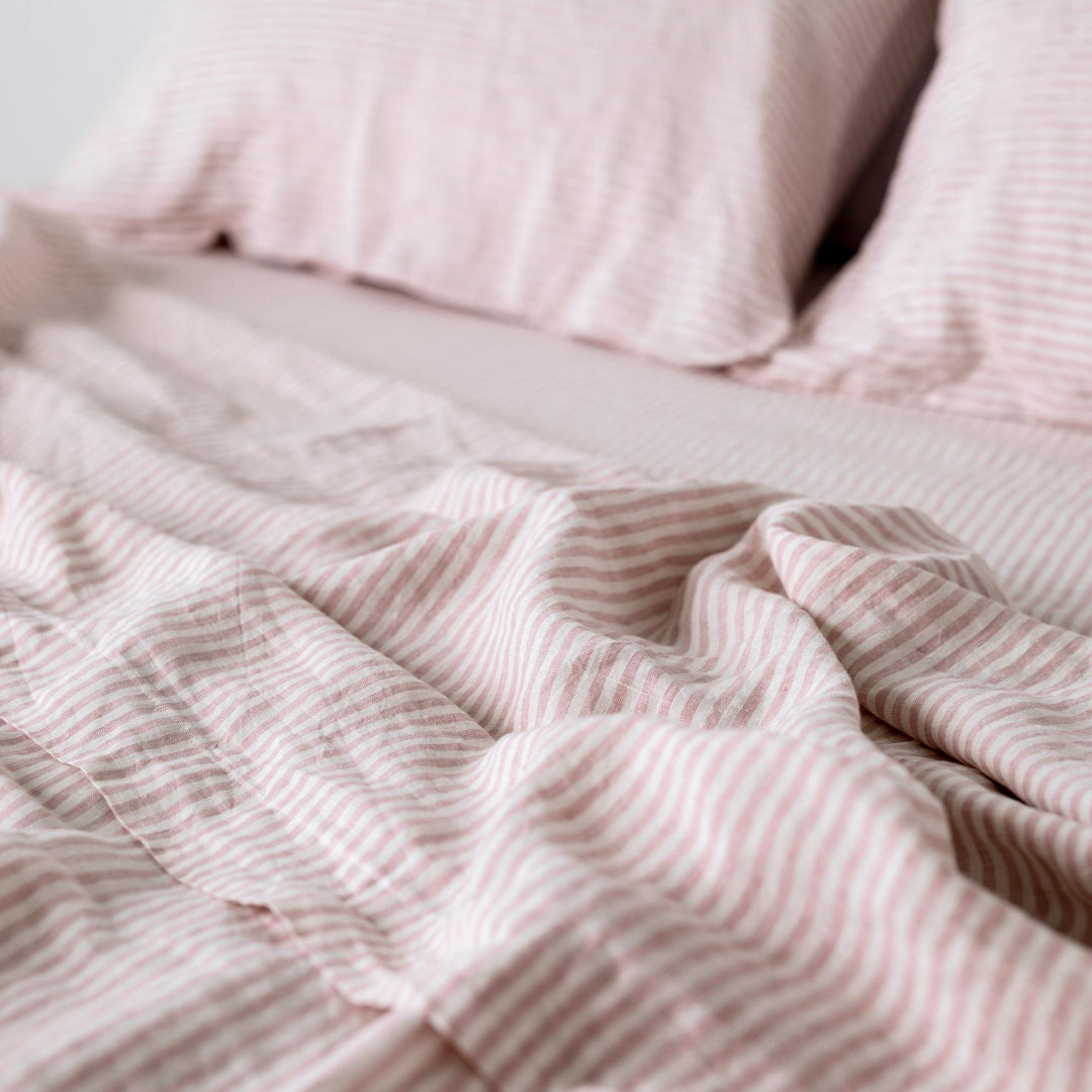 Foxtrot Home French Flax Linen styled in a bedroom with Pink Stripes Flat Sheet.