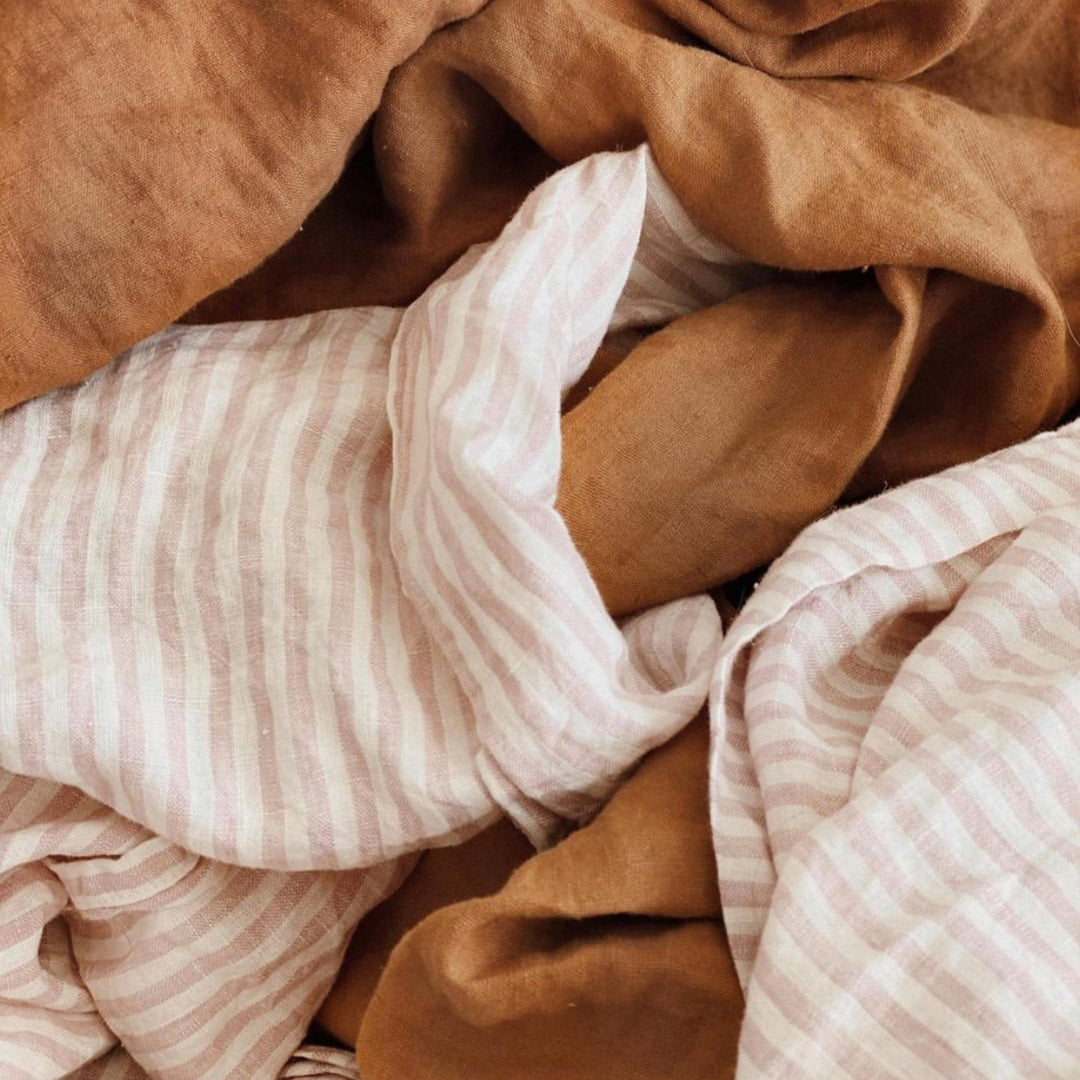 Foxtrot Home French Flax Linen styled in a bedroom with Pink Stripes Flat Sheet.