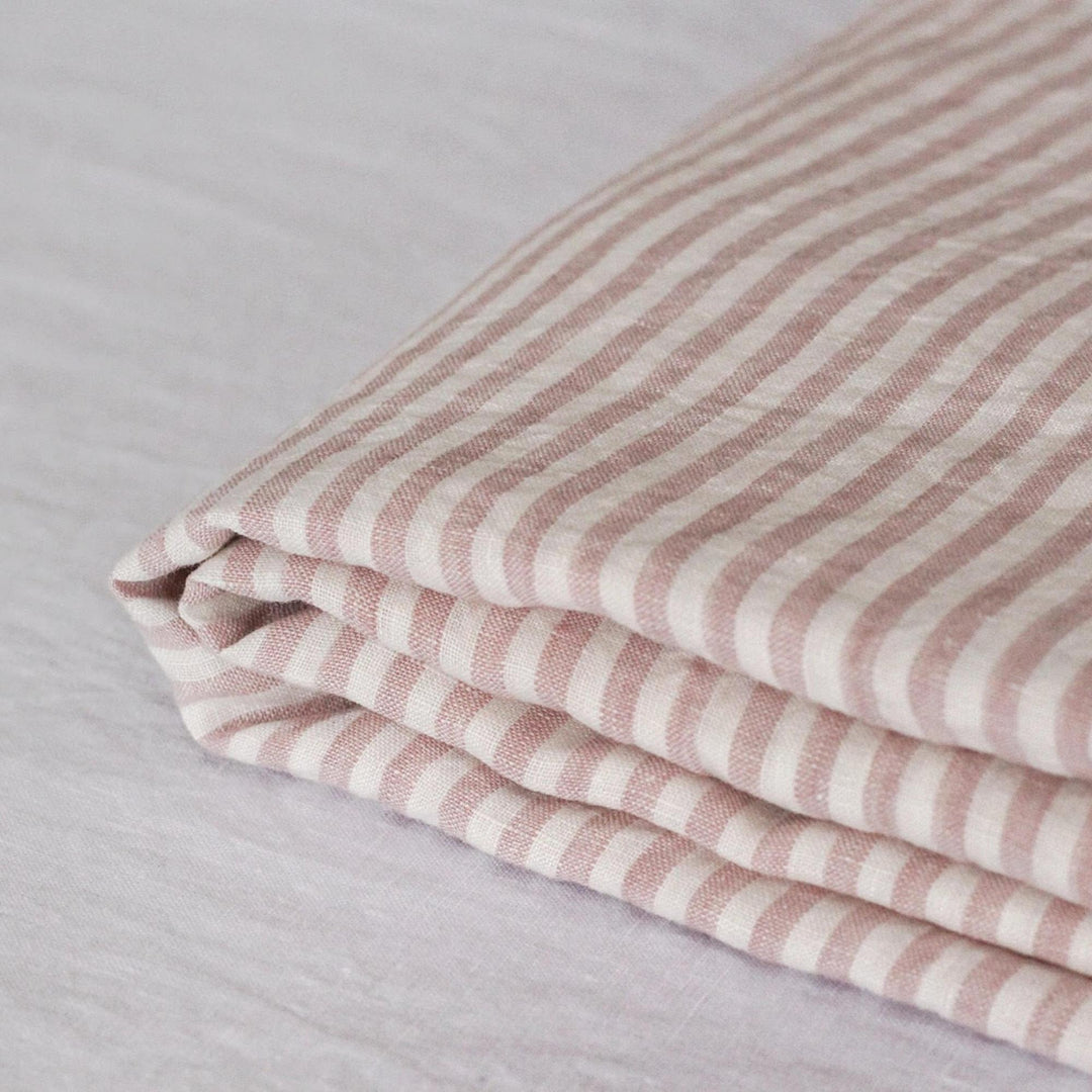 Foxtrot Home French Flax Linen styled in a bedroom with Pink Stripes Sheet Sheets.