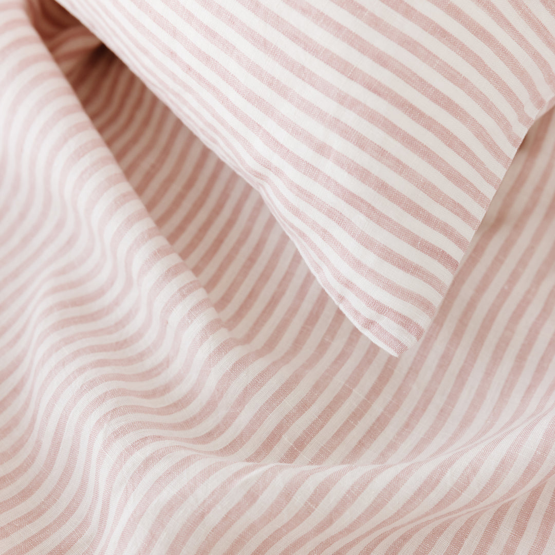 Foxtrot Home French Flax Linen styled in a bedroom with Pink Stripes Sheet Sheets.