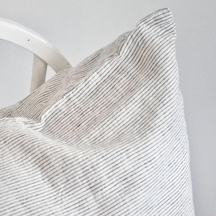 Foxtrot Home French Flax Linen styled in a bedroom with Pinstripes Cushion Cover.