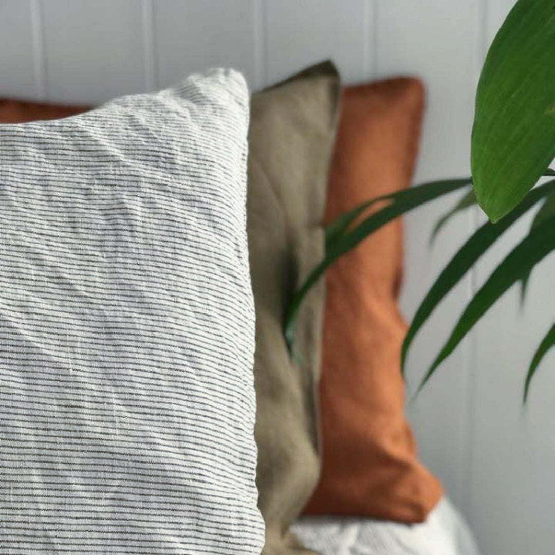 Foxtrot Home French Flax Linen styled in a bedroom with Pinstripes Cushion Cover.