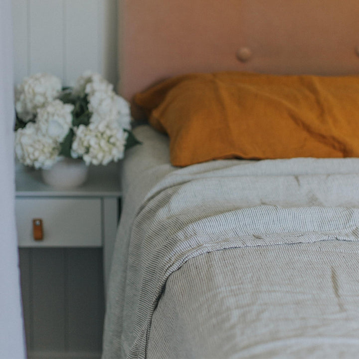 Foxtrot Home French Flax Linen styled in a bedroom with Pinstripe Fitted Sheet.