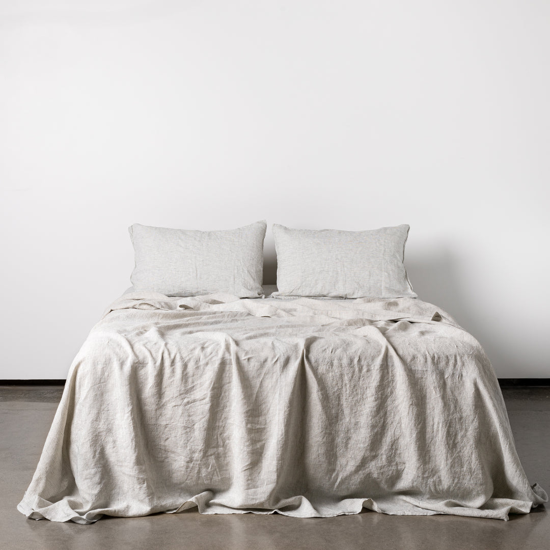 Foxtrot Home French Flax Linen styled in a bedroom with Pinstripe Fitted Sheet.