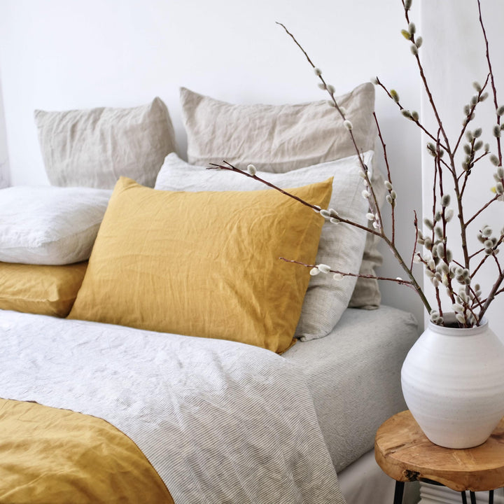 Foxtrot Home French Flax Linen styled in a bedroom with Pinstripe Fitted Sheet.