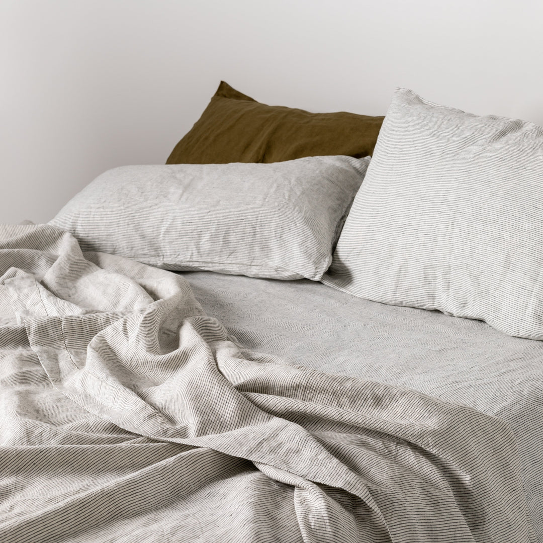 Foxtrot Home French Flax Linen styled in a bedroom with Pinstripe Sheets Sets.