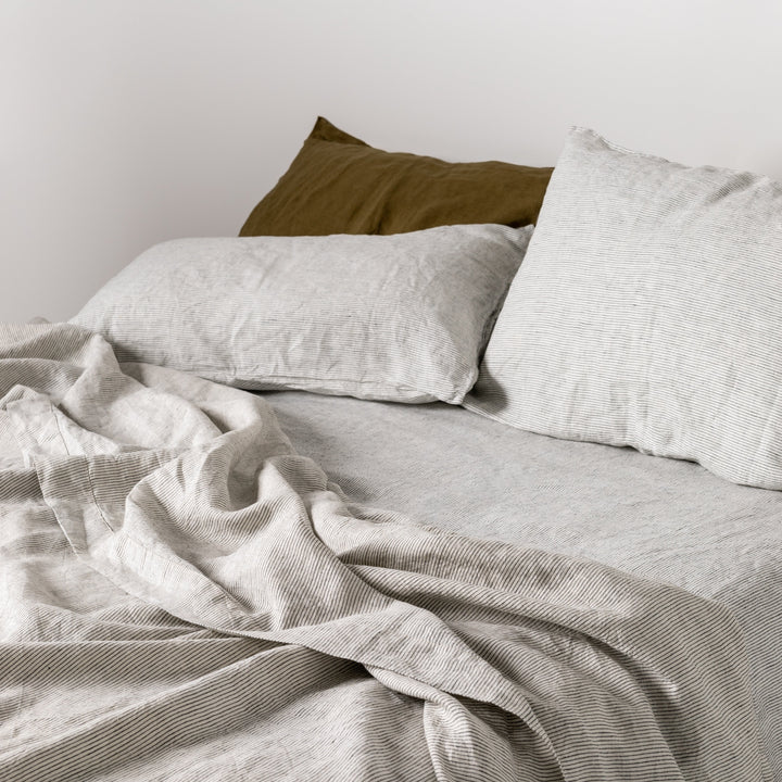 Foxtrot Home French Flax Linen styled in a bedroom with Pinstripe Sheets Sets.