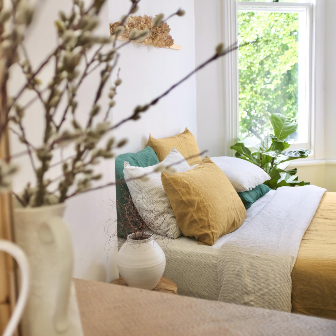 Foxtrot Home French Flax Linen styled in a bedroom with Pinstripe Sheets Sets.