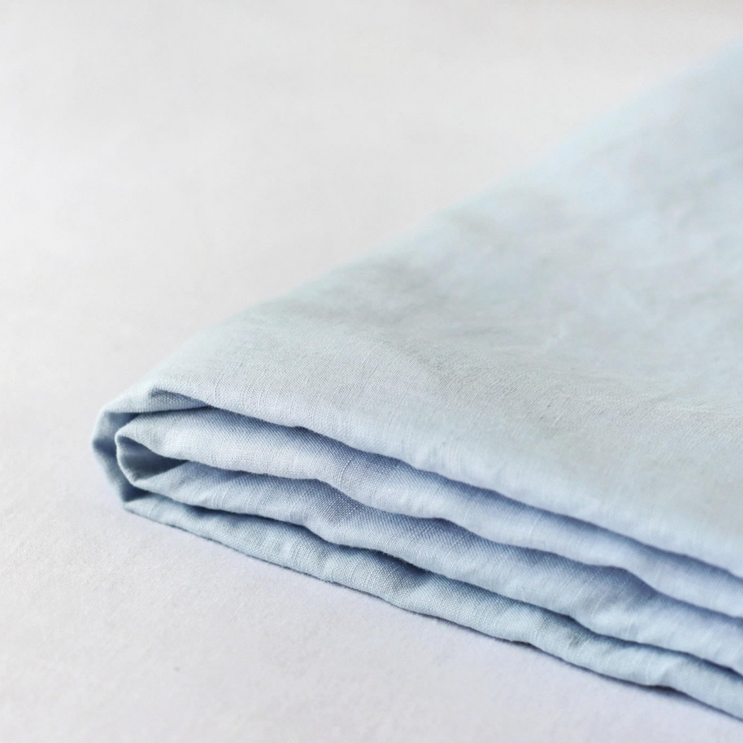 Foxtrot Home French Flax Linen styled in a bedroom with Powder Blue Fitted Sheet.