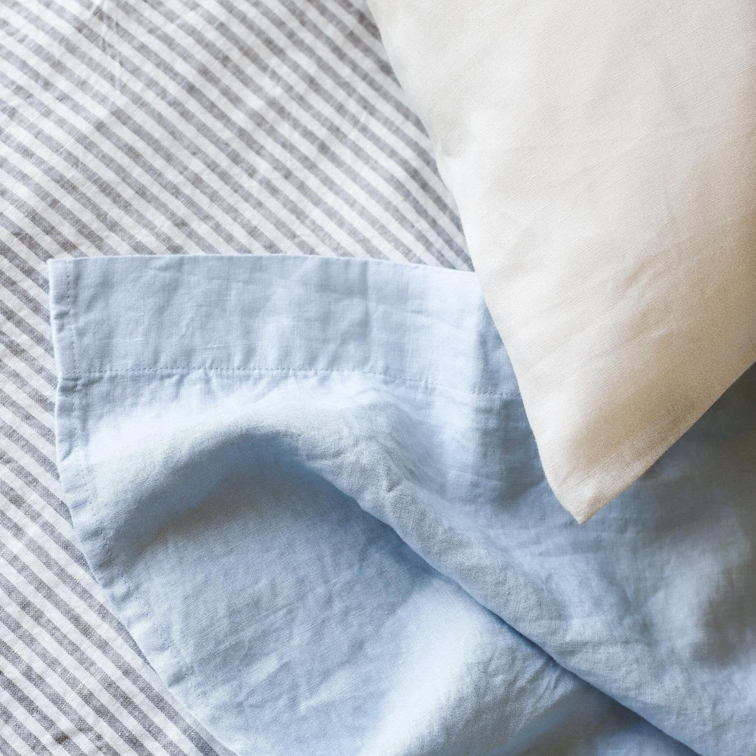 Foxtrot Home French Flax Linen styled in a bedroom with Powder Blue Sheets Set.
