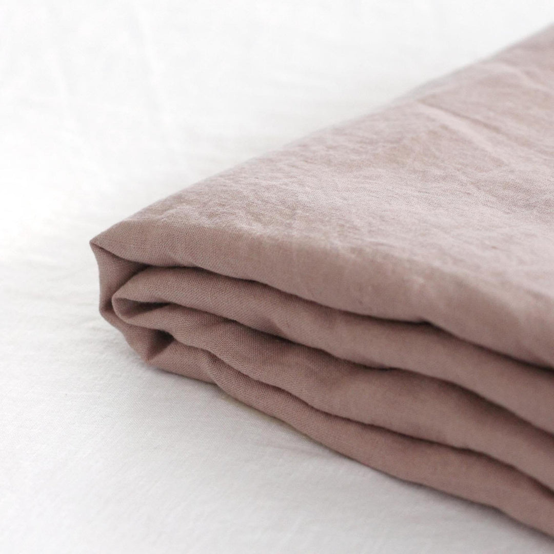 Foxtrot Home French Flax Linen styled in a bedroom with Rosewood Pink Fitted Sheet.