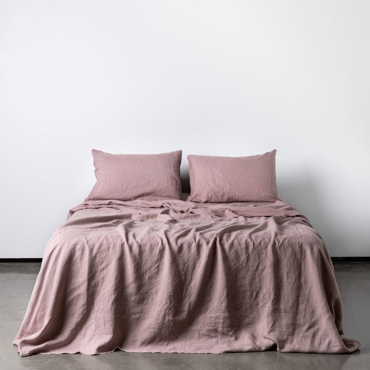 Foxtrot Home French Flax Linen styled in a bedroom with Rosewood Pink Fitted Sheet.