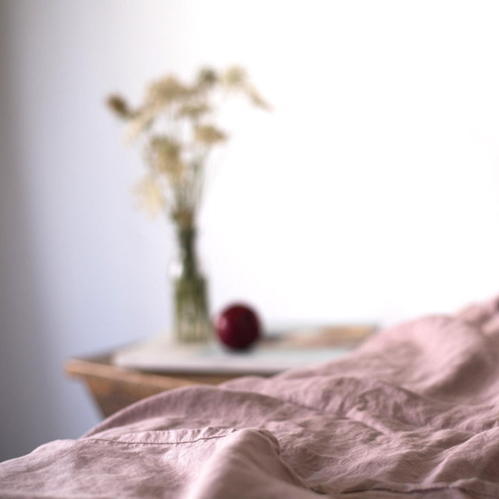 Foxtrot Home French Flax Linen styled in a bedroom with Rosewood Pink Fitted Sheet.