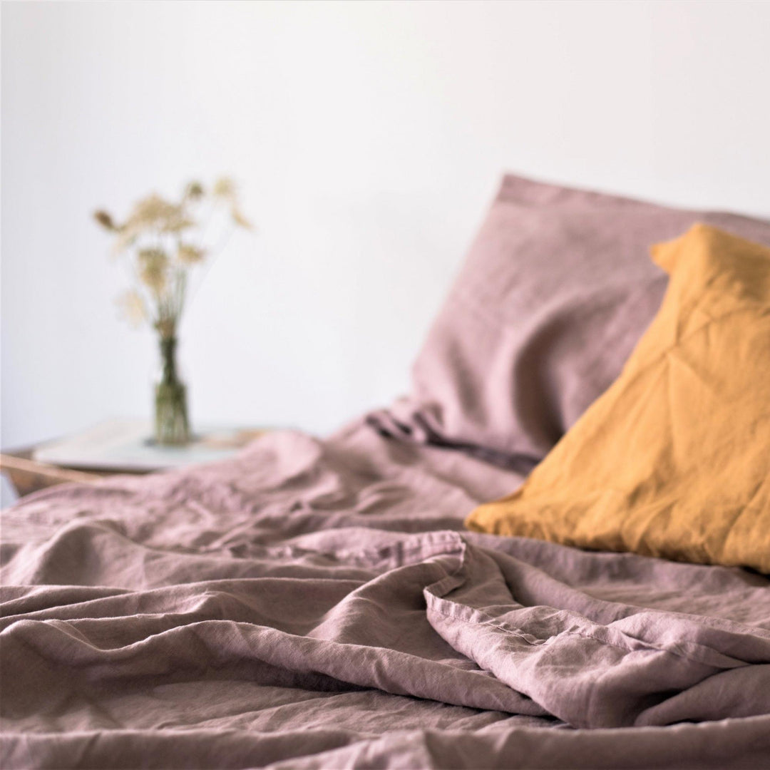 Foxtrot Home French Flax Linen styled in a bedroom with Rosewood Pink Fitted Sheet.