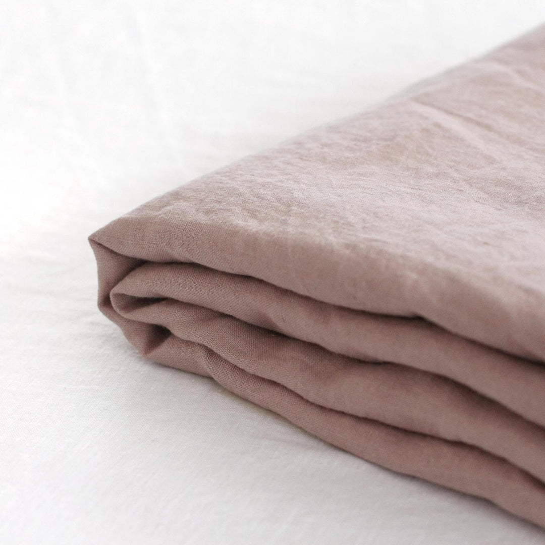 Foxtrot Home French Flax Linen styled in a bedroom with Rosewood Pink Sheets Set.