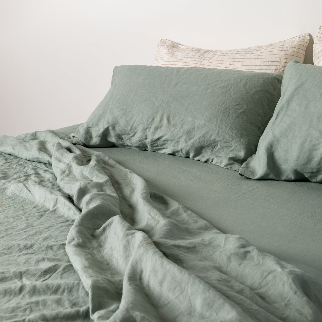 Foxtrot Home French Flax Linen styled in a bedroom with Sage Green Fitted Sheet.