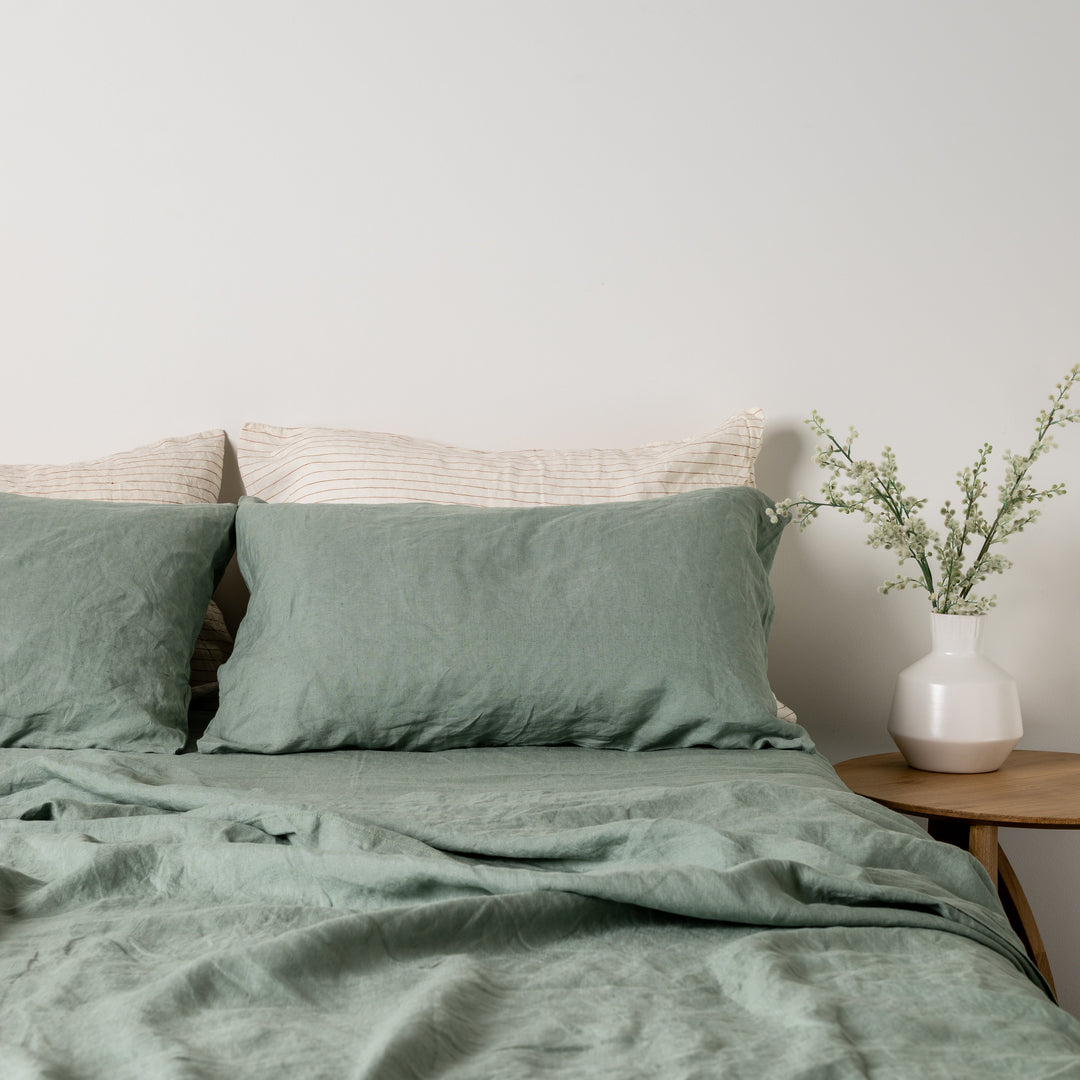 Foxtrot Home French Flax Linen styled in a bedroom with Sage Green Fitted Sheet.
