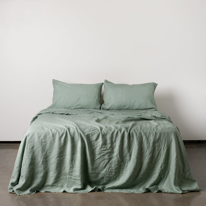 Foxtrot Home French Flax Linen styled in a bedroom with Sage Green Sheets Set.