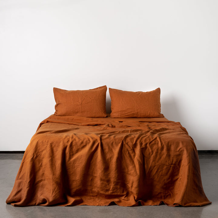 Foxtrot Home French Flax Linen styled in a bedroom with Tobacco Fitted Sheet.