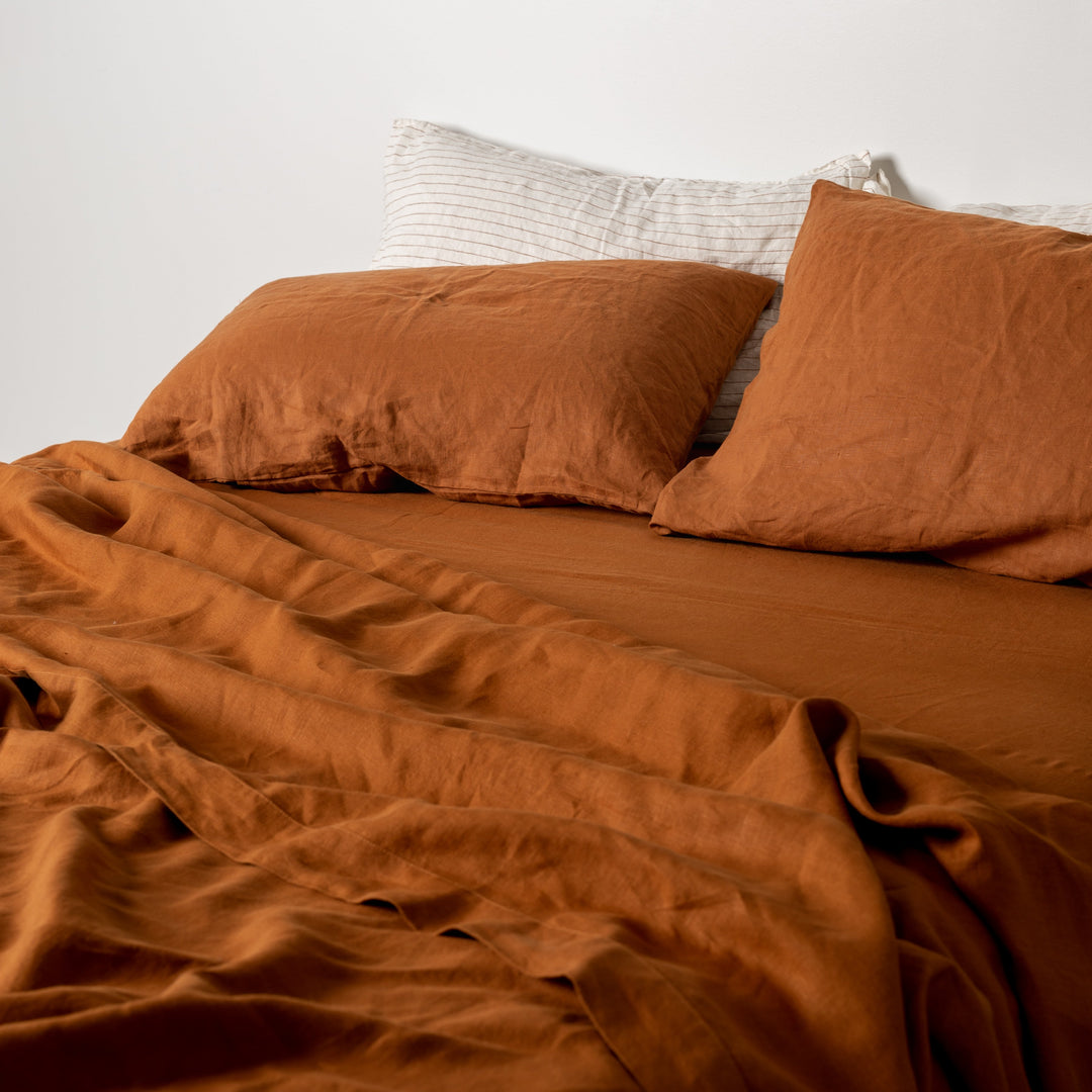 Foxtrot Home French Flax Linen styled in a bedroom with Tobacco Fitted Sheet.