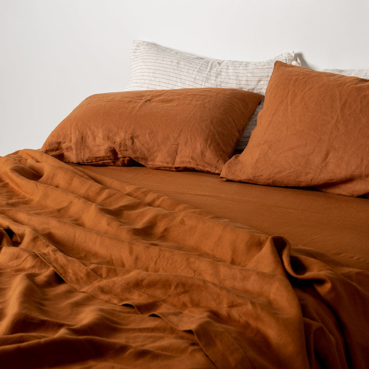 Foxtrot Home French Flax Linen styled in a bedroom with Tobacco Fitted Sheet.