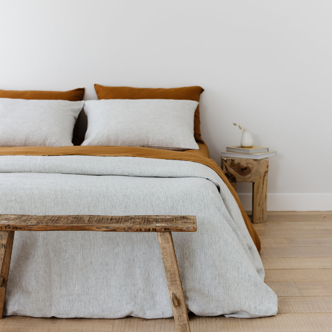 Foxtrot Home French Flax Linen styled in a bedroom with Tobacco Fitted Sheet.