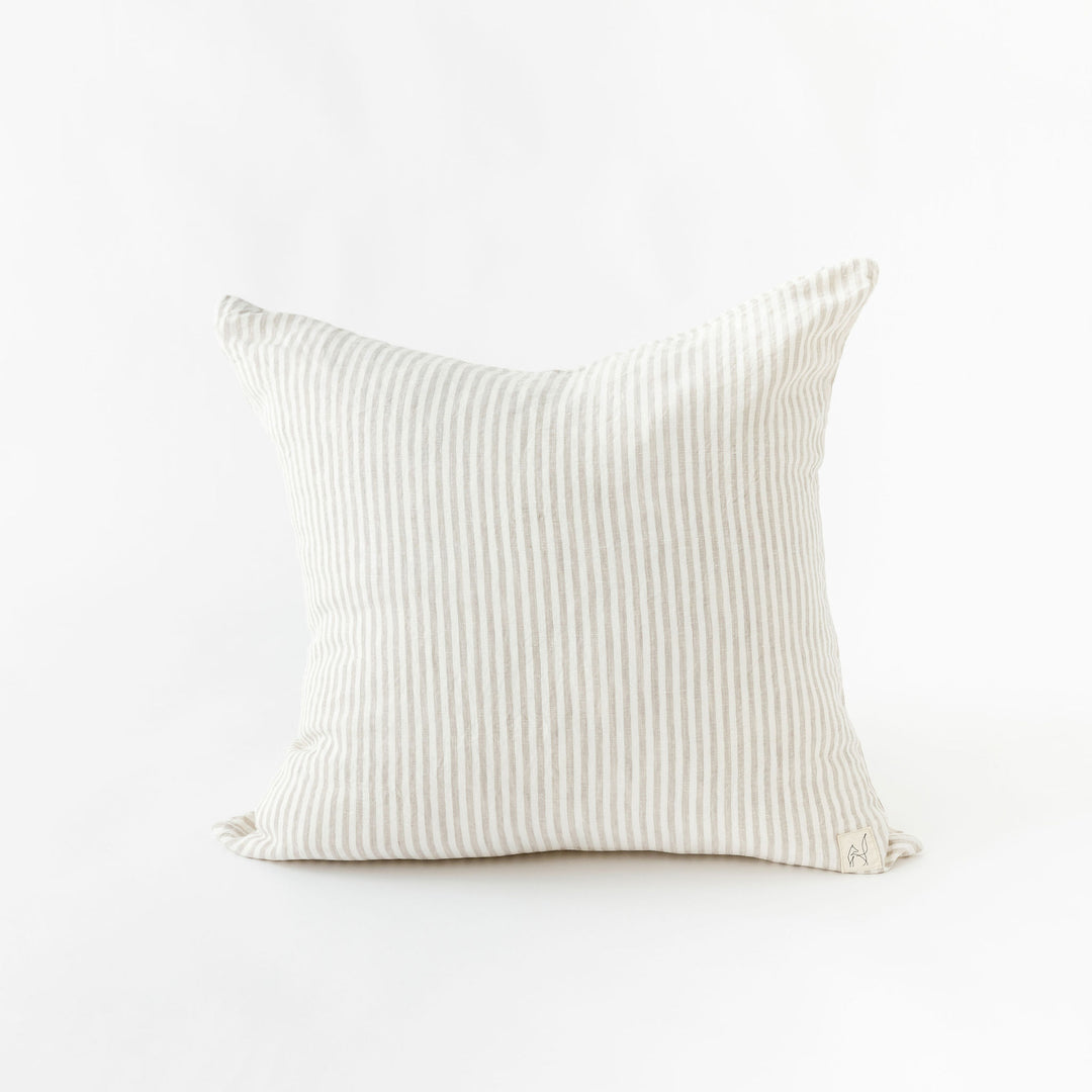 Foxtrot Home French Flax Linen styled in a bedroom with Sand Stripes Cushion Cover.
