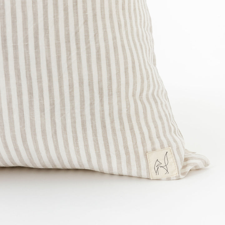 Foxtrot Home French Flax Linen styled in a bedroom with Sand Stripes Cushion Cover.